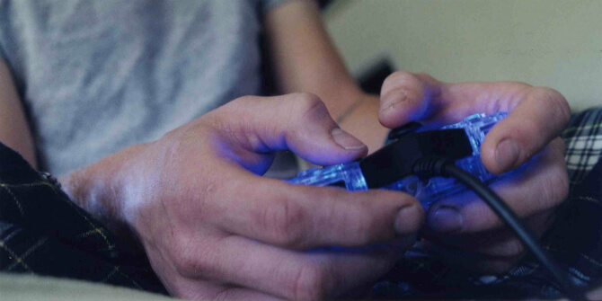 closeup of hand handling a video game controller